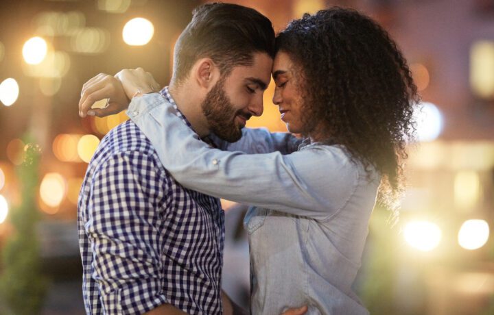 Shot of an affectionate young couple out on a date in the city.