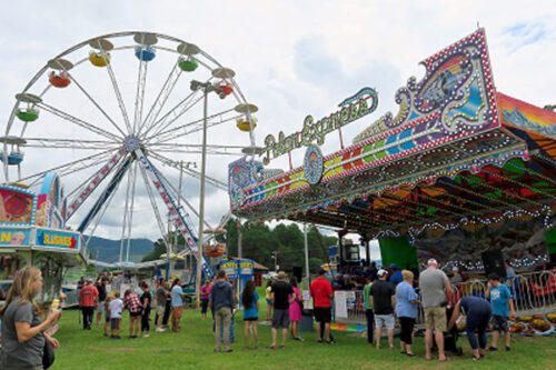 Carnival ferris wheel and vendor booth at the georgia national fair