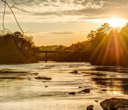 landscape picture of a sunset at chattahoochee river, one of the atlanta state nature areas