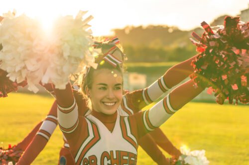 Main focus on a cheerleader during a routine