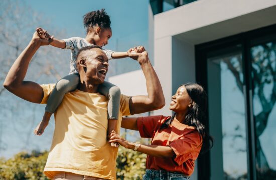 happy family at their new home in one of the cities in gwinnett county