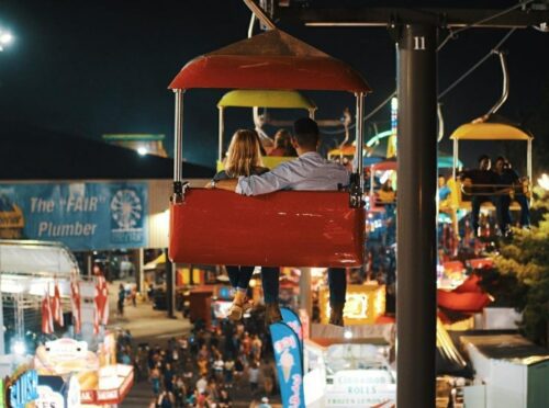 Couple on a ferris wheel at night