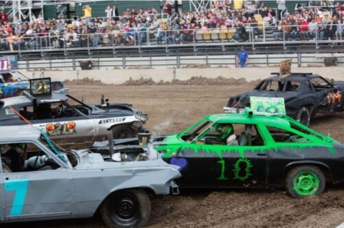 an arena filled with fans watching demolition derby